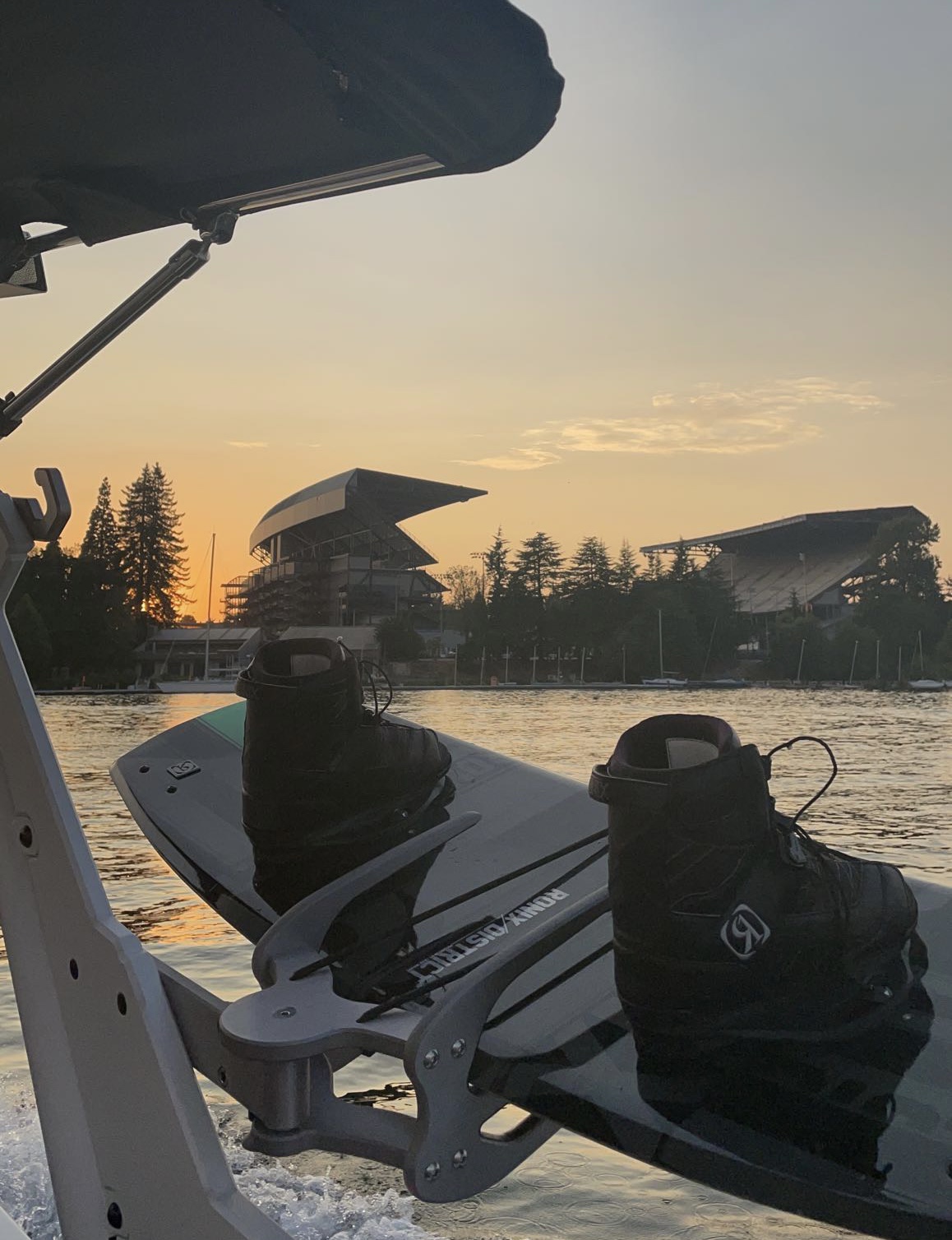 View of University of Washington stadium from a boat in Lake Washington